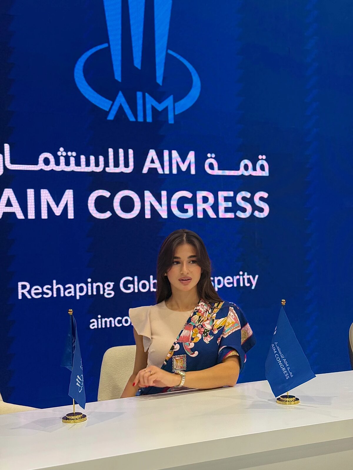 Seated at a desk at AIM Congress